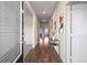 Inviting foyer featuring hardwood floors, stylish decor, and a view of the home's layout at 1259 Fendt Dr, Locust Grove, GA 30248