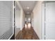 Inviting foyer featuring hardwood floors, stylish decor, and a view of the home's layout at 1259 Fendt Dr, Locust Grove, GA 30248