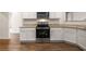 Well-equipped kitchen with granite countertops, stainless steel oven, and stylish cabinetry offers a functional layout at 1259 Fendt Dr, Locust Grove, GA 30248