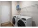 Convenient laundry room with modern washer and dryer set, maximizing space and efficiency for everyday tasks at 1259 Fendt Dr, Locust Grove, GA 30248
