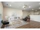Open-concept living area with view into dining, featuring hardwood floors and natural light at 1259 Fendt Dr, Locust Grove, GA 30248