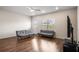 Spacious living room with ceiling fan and natural light at 1259 Fendt Dr, Locust Grove, GA 30248