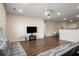 Open-concept living area with view into dining, featuring hardwood floors and natural light at 1259 Fendt Dr, Locust Grove, GA 30248