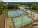 Aerial view of the community tennis and basketball courts offering recreational opportunities for residents at 1259 Fendt Dr, Locust Grove, GA 30248