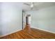 Bedroom with hardwood floors, neutral walls and a ceiling fan with access to the rest of the house at 1412 Woodbine Se Ave, Atlanta, GA 30317