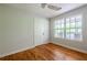This bright bedroom has hardwood floors, and a large window overlooking the yard at 1412 Woodbine Se Ave, Atlanta, GA 30317