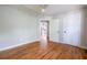 Bedroom featuring a ceiling fan, hardwood floors, and access to the rest of the house at 1412 Woodbine Se Ave, Atlanta, GA 30317