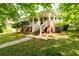 Charming covered front porch with brick accents, inviting entry, and landscaped surroundings at 1412 Woodbine Se Ave, Atlanta, GA 30317