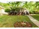 Charming home featuring a inviting front porch, landscaped yard, and stone walkway at 1412 Woodbine Se Ave, Atlanta, GA 30317