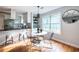 Eat-in kitchen featuring modern finishes, a breakfast bar, and a large window at 1412 Woodbine Se Ave, Atlanta, GA 30317