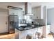 Bright kitchen with stainless appliances, gas cooktop, and breakfast bar seating at 1412 Woodbine Se Ave, Atlanta, GA 30317