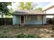 Exterior of home in green backyard with a wood fence at 1594 Lincoln Se Ave, Atlanta, GA 30317
