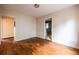 The bedroom has hardwood floors and neutral-colored walls at 1594 Lincoln Se Ave, Atlanta, GA 30317