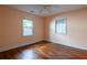 Bedroom featuring hardwood floors, a ceiling fan and windows at 1594 Lincoln Se Ave, Atlanta, GA 30317