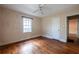 Bedroom featuring hardwood floors, a ceiling fan, and a doorway at 1594 Lincoln Se Ave, Atlanta, GA 30317