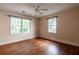 Bedroom with hardwood floors, a ceiling fan, and a window letting in natural light at 1594 Lincoln Se Ave, Atlanta, GA 30317
