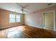 Bedroom with hardwood floors, a ceiling fan, and a window letting in natural light at 1594 Lincoln Se Ave, Atlanta, GA 30317