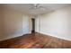 Spacious bedroom featuring hardwood floors, a ceiling fan, and two doors at 1594 Lincoln Se Ave, Atlanta, GA 30317