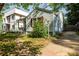 This is the side view of a single-story home showing the driveway and quaint landscaping at 1594 Lincoln Se Ave, Atlanta, GA 30317