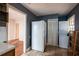 Roomy kitchen featuring a refrigerator, a stacked washer/dryer, and tile flooring at 1594 Lincoln Se Ave, Atlanta, GA 30317