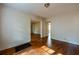 A spacious living room featuring hardwood floors and multiple doorways at 1594 Lincoln Se Ave, Atlanta, GA 30317