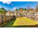 Fenced yard with green grass, ideal for outdoor activities at 2325 Thackery Rd, Snellville, GA 30078