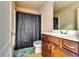 Full bathroom features a vanity with sink and enclosed shower at 2325 Thackery Rd, Snellville, GA 30078