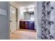 Bathroom featuring double sink vanity and framed mirror at 2325 Thackery Rd, Snellville, GA 30078