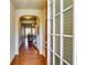 Inviting foyer with hardwood floors, arched entryway, and view into the living room at 2325 Thackery Rd, Snellville, GA 30078