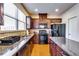 Modern kitchen features a large island, granite countertops, and stainless appliances at 2325 Thackery Rd, Snellville, GA 30078