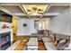 Inviting living room boasts a coffered ceiling, fireplace, and comfortable sectional sofa at 2325 Thackery Rd, Snellville, GA 30078