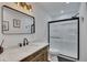 A bathroom with marble countertops, a modern sink, and glass shower at 507 Honeysuckle Ln, Woodstock, GA 30188