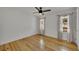 Bright bedroom with hardwood floors and two windows offering plenty of natural light at 507 Honeysuckle Ln, Woodstock, GA 30188