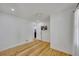 This bedroom is bright and airy, featuring hardwood floors and recessed lighting at 507 Honeysuckle Ln, Woodstock, GA 30188