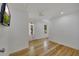 Bright bedroom with hardwood floors and two windows offering natural light at 507 Honeysuckle Ln, Woodstock, GA 30188