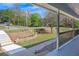 Inviting porch with stone-lined garden and view of a sprawling front yard at 507 Honeysuckle Ln, Woodstock, GA 30188