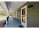 Covered front porch featuring wood door and classic exterior lighting fixtures at 507 Honeysuckle Ln, Woodstock, GA 30188