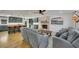 Open-concept living room flows into a stylish kitchen with a brick fireplace at 507 Honeysuckle Ln, Woodstock, GA 30188