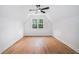 Attic bedroom featuring hardwood floors and a bright window at 5260 Moore St, Stone Mountain, GA 30083