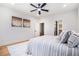 Bright bedroom featuring a ceiling fan, neutral walls, and hardwood floors at 5260 Moore St, Stone Mountain, GA 30083