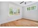 Inviting bedroom with hardwood floors and multiple windows offering plenty of natural light at 5260 Moore St, Stone Mountain, GA 30083