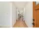 Bright entryway with light wood floors, white walls, and views into the home's open floor plan at 5260 Moore St, Stone Mountain, GA 30083