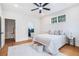 Serene main bedroom featuring hardwood floors, natural light, and an en-suite bathroom at 5260 Moore St, Stone Mountain, GA 30083