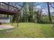 View of the large backyard and wooden deck, perfect for outdoor activities and relaxation at 616 Country Lane Dr, Jonesboro, GA 30238