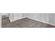 Neutral bedroom features plush carpeting, white baseboards, and a white door at 616 Country Lane Dr, Jonesboro, GA 30238