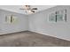 Spacious bedroom with neutral walls, carpet, and a ceiling fan at 616 Country Lane Dr, Jonesboro, GA 30238