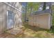 An exterior door on the side of the house with a matching shed at 616 Country Lane Dr, Jonesboro, GA 30238
