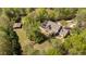Aerial view of a sprawling property with a house, pool, outbuilding, and lush greenery at 2839 Echols Rd, Cumming, GA 30041