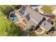 Aerial view of an estate featuring a sparkling pool, mature trees, and well-manicured landscaping at 2839 Echols Rd, Cumming, GA 30041