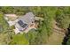 Expansive aerial view of the home and grounds, highlighting the pool, solar panels, and extensive greenery at 2839 Echols Rd, Cumming, GA 30041